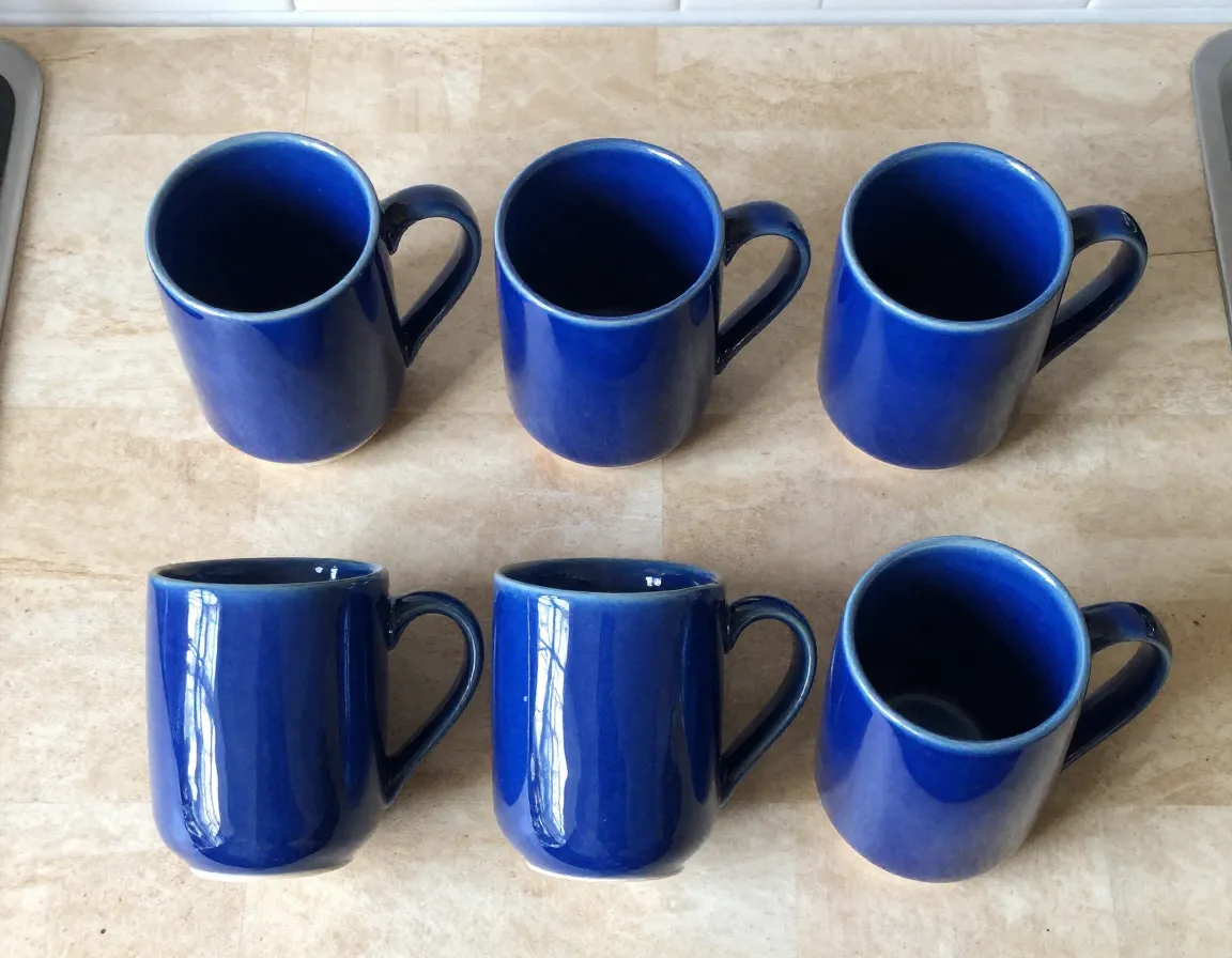 Vicrays 12 oz blue ceramic coffee mug set on a kitchen counter